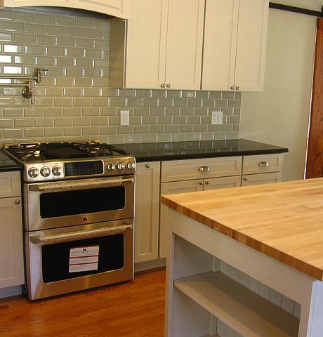 pot filler, barn door and wood top island